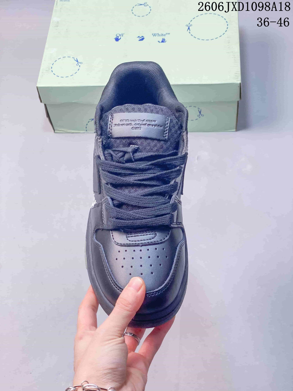 Top view of the sneaker showing its laces, padded tongue and perforated toe