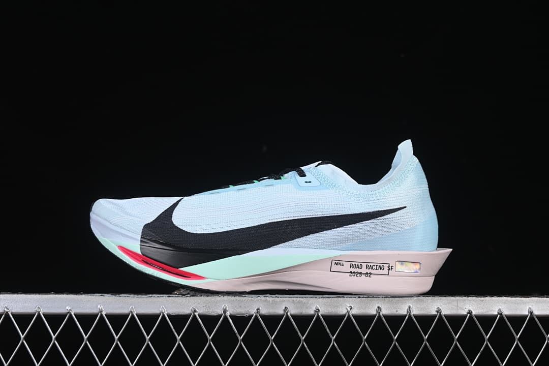 Side view of pale blue Nike ZoomX Streakfly 2 running shoe with black Swoosh and mint and pink accents