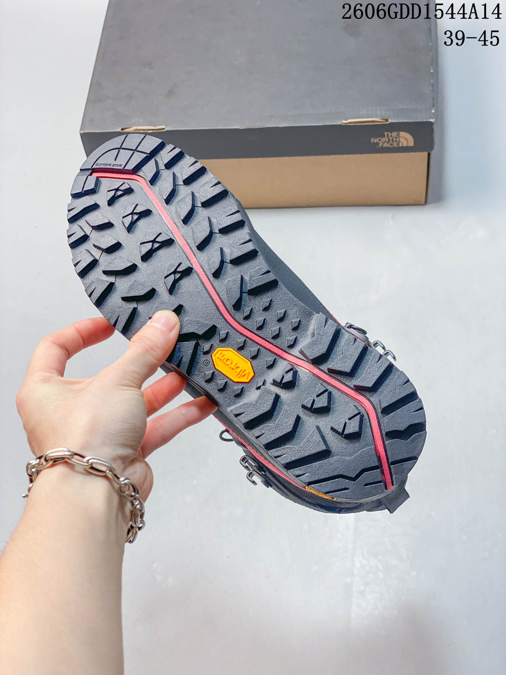 Close-up of the hiking boot outsole with prominent tread lugs