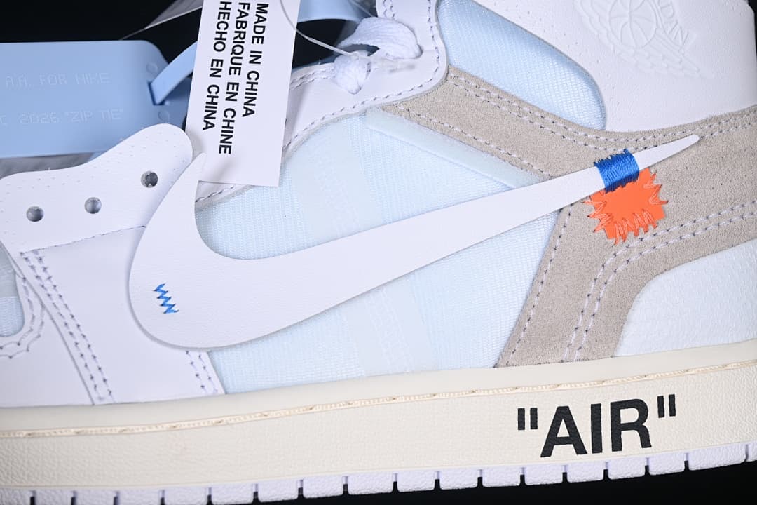 Close-up of the side Swoosh, blue and orange accents, and AIR midsole text