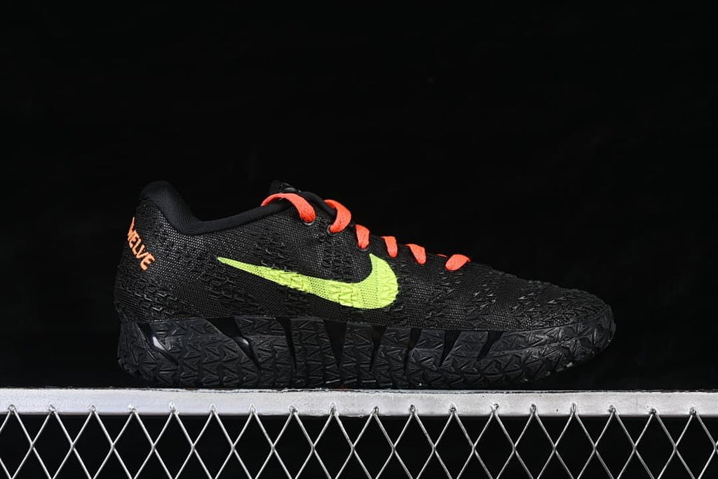 Side view of the black shoe with bright lime side swoosh and orange-red laces.