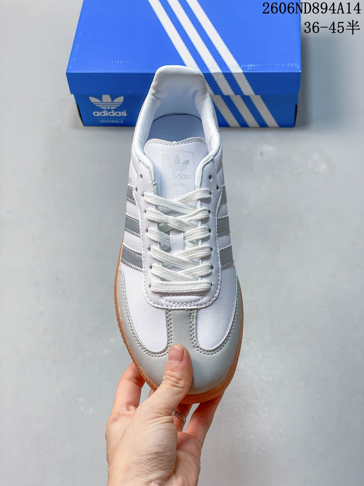 Top view of a white adidas Samba sneaker with silver toe accents and lace-up closure