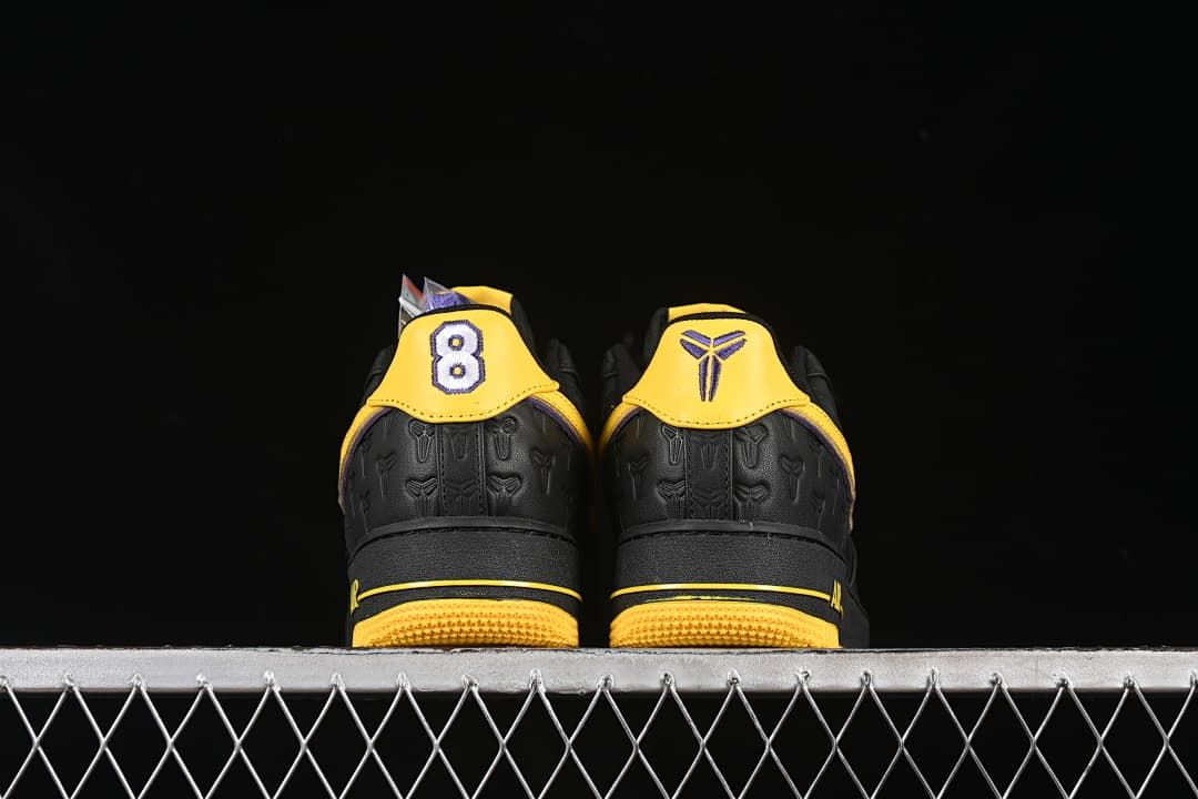 Rear view of both shoes showing contrasting heel graphics.