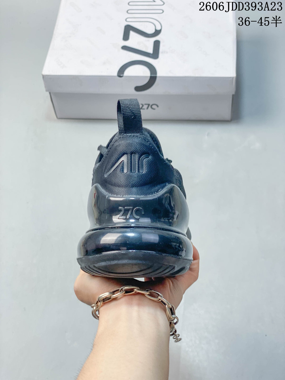 Rear view of a dark gray Nike Air Max 270 sneaker showing the heel Air unit