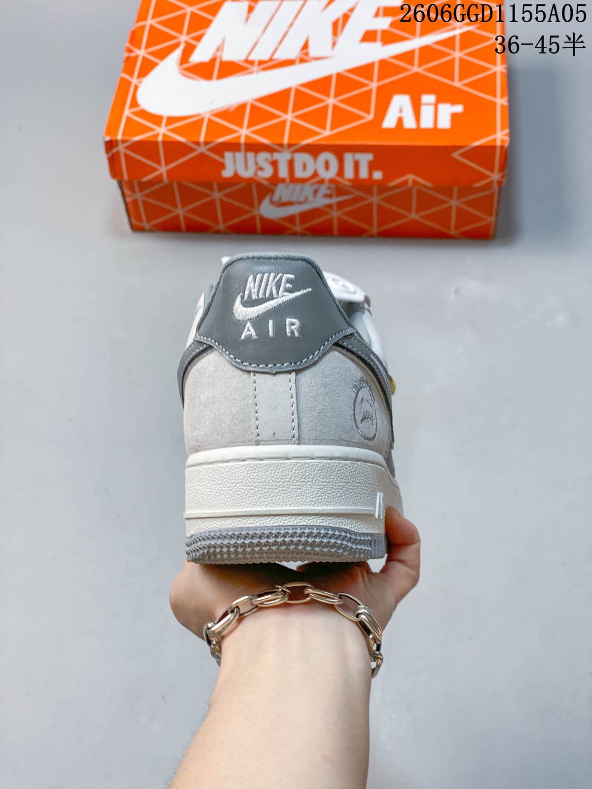 Rear view of a grey and white Nike Air Force 1 sneaker