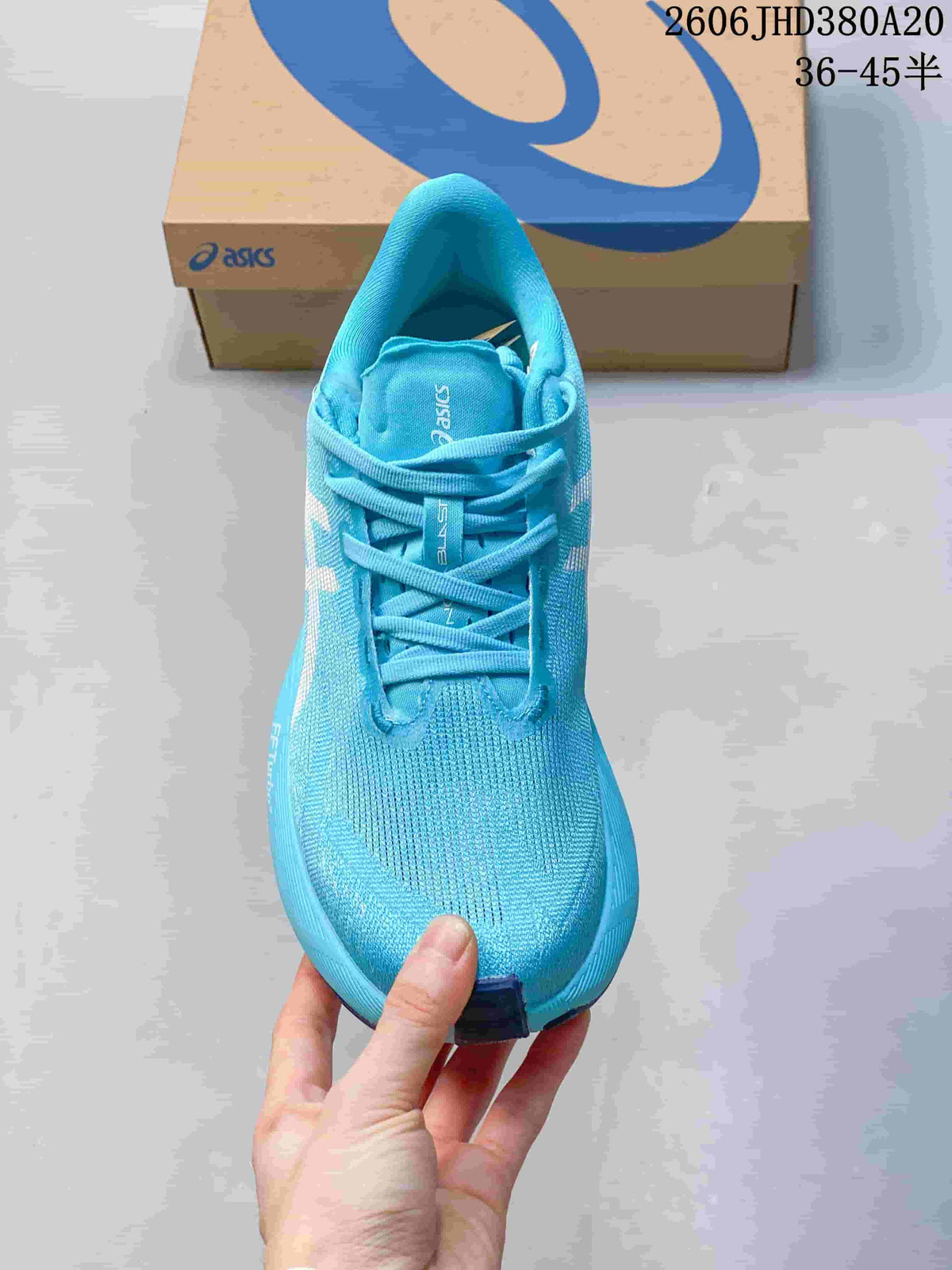 Top view of the blue lace-up running shoe
