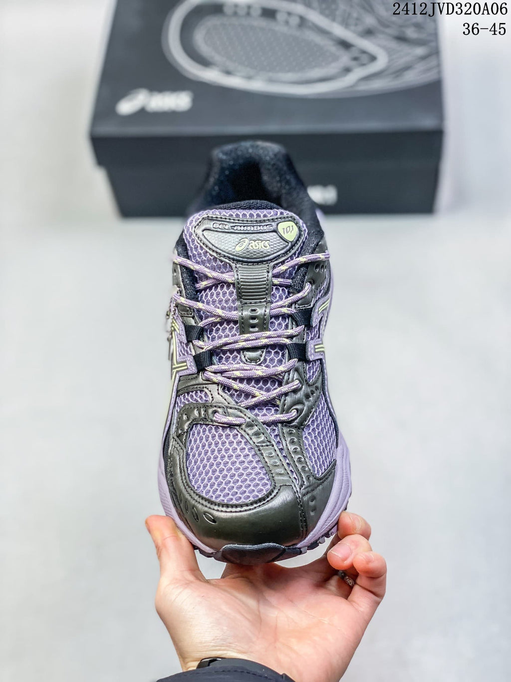 Front view of the mesh-style upper and laces on a purple ASICS Gel-Nimbus 10.1 sneaker.
