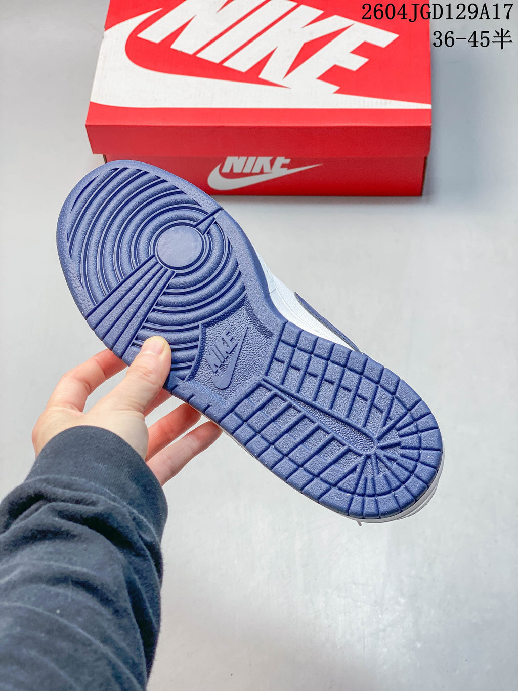 Close-up of the blue patterned outsole on a Nike Big Low sneaker