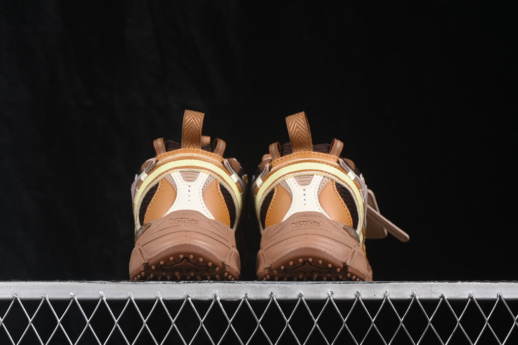 Rear view of the paired sneakers showing heel panels, pull tabs and raised outsole tread.
