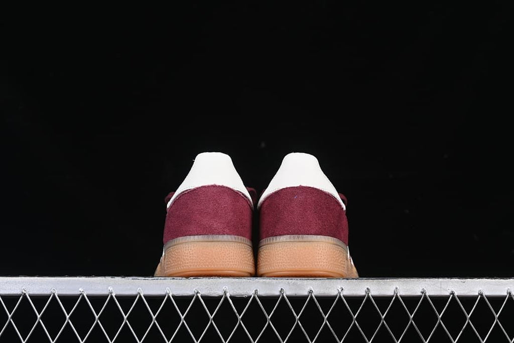 Rear view of both sneakers with white heel details and gum-colored soles