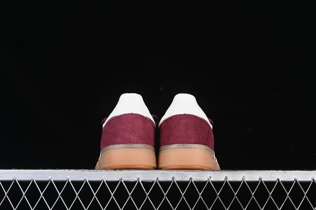 Rear view of both sneakers with white heel details and gum-colored soles