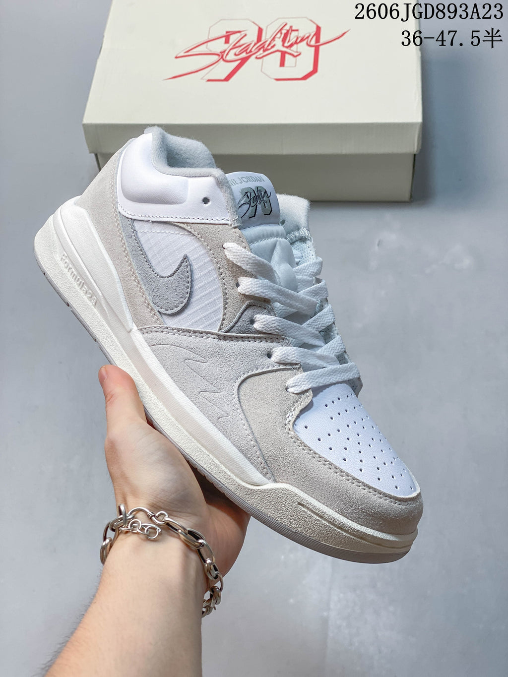 Angled close-up of the sneaker’s side panels, Swoosh and sculpted midsole