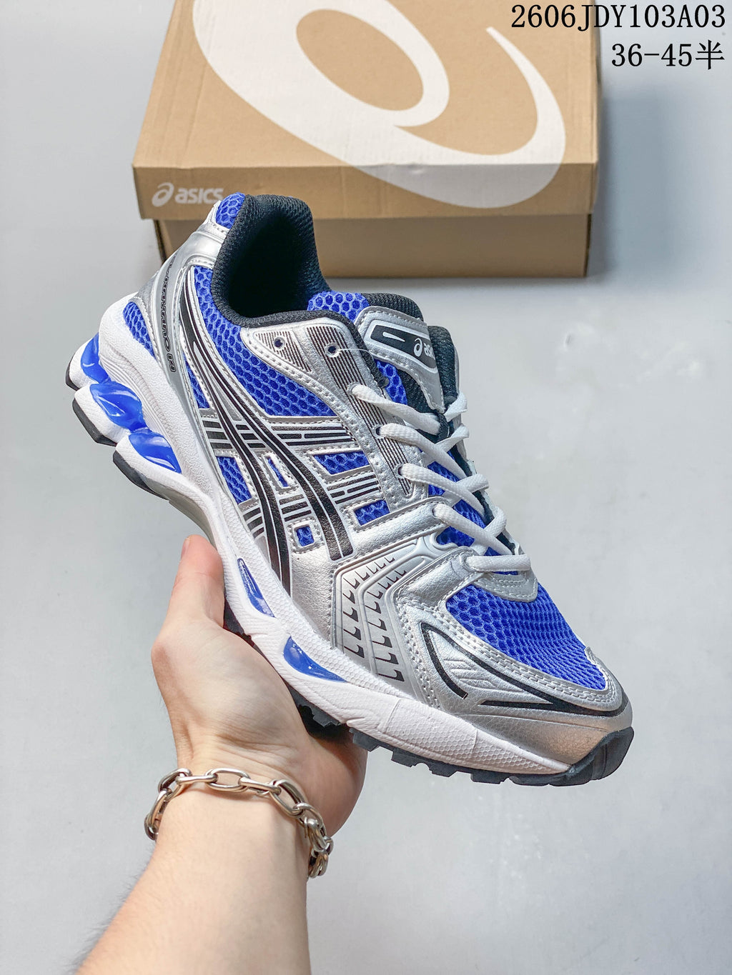 Blue and silver ASICS GEL-KAYANO 14 sneaker with white laces
