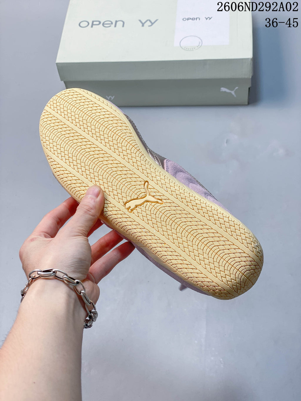 Close-up of the pale gum-colored outsole with patterned tread and a Puma logo.
