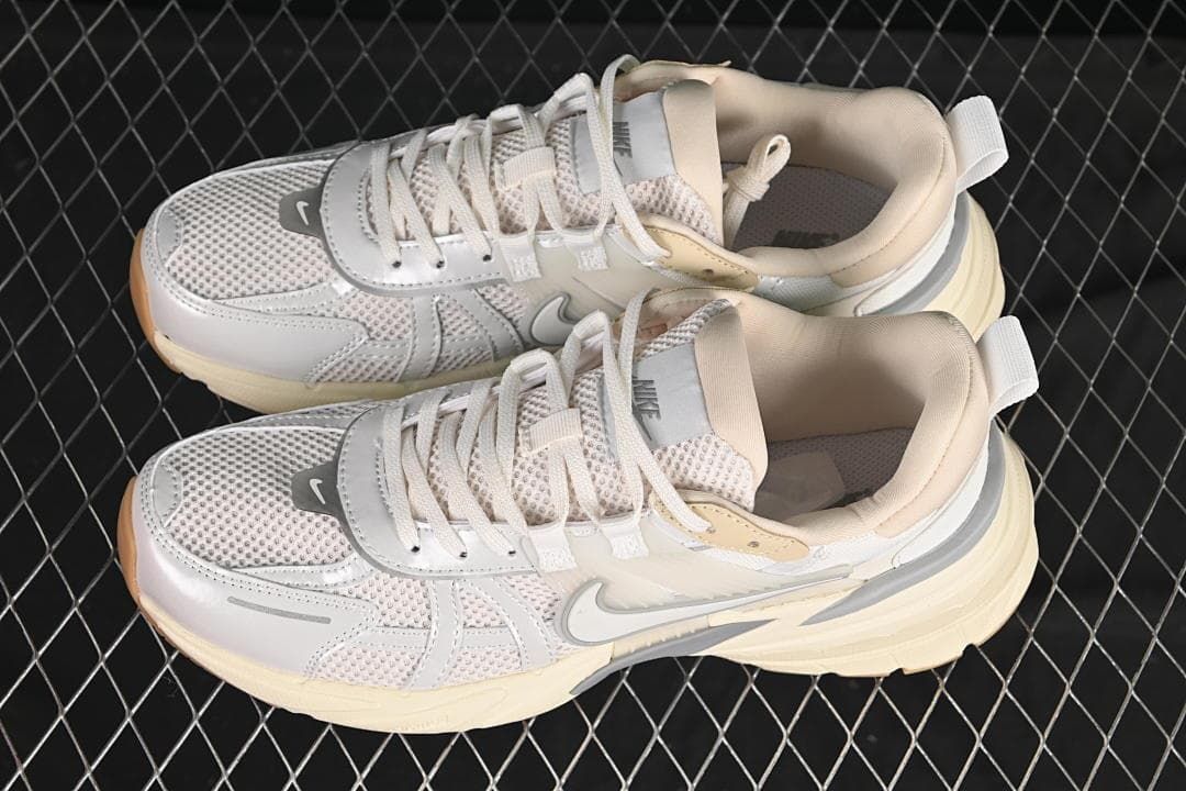 Pair of light neutral Nike V2K Run Tekk sneakers viewed from above