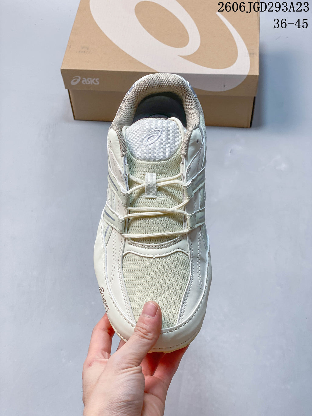 Top view of the cream sneaker showing mesh-look panels and laces