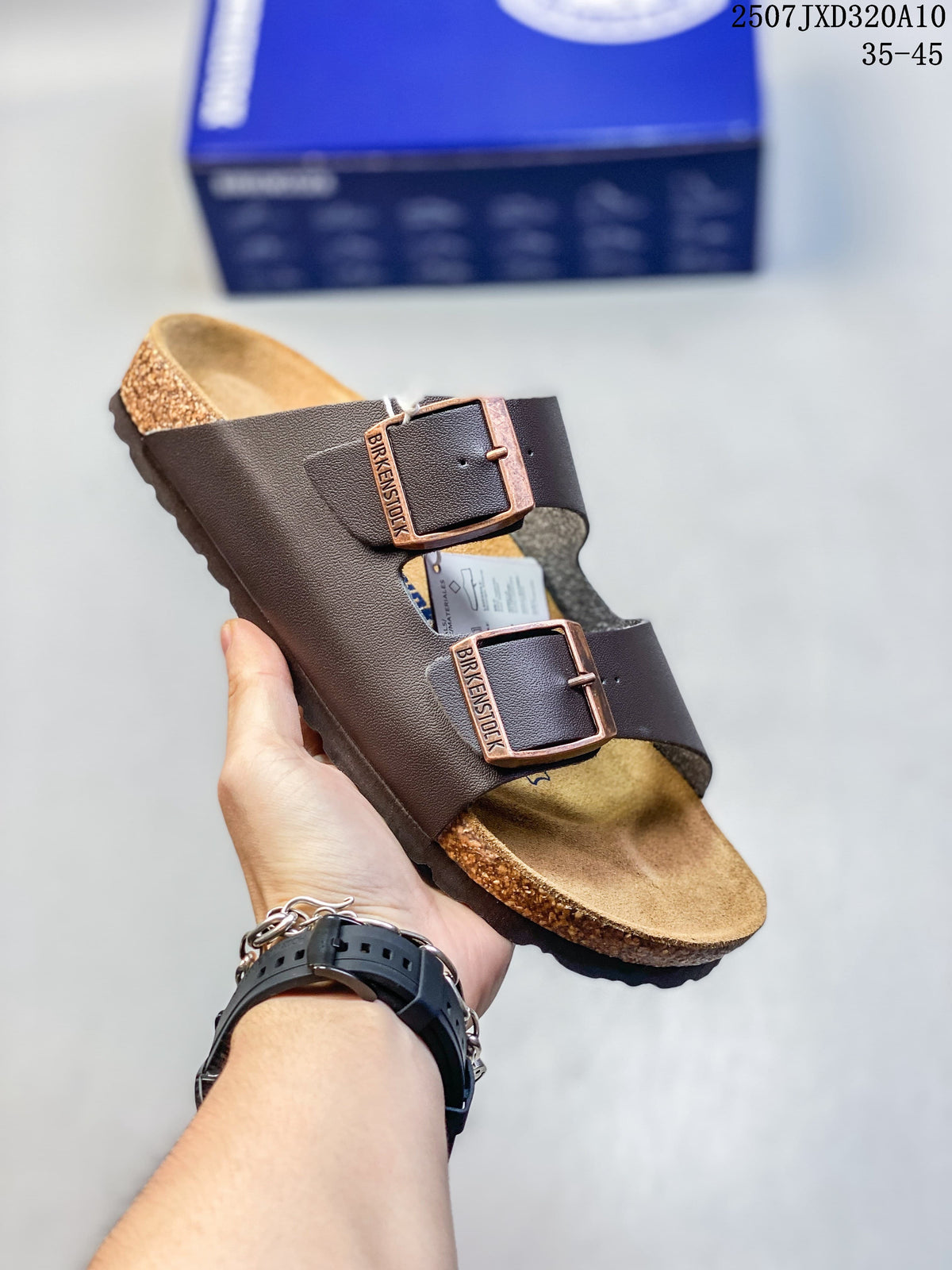 Angled view of a dark brown two-strap slide sandal with adjustable buckles.