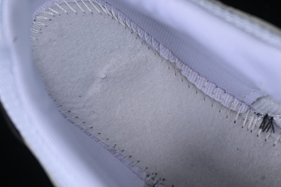 Close-up view inside the sneaker showing the lining and stitching.