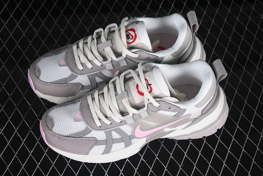 Pair of white, gray, and pink Nike V2K Run Runtekk sneakers