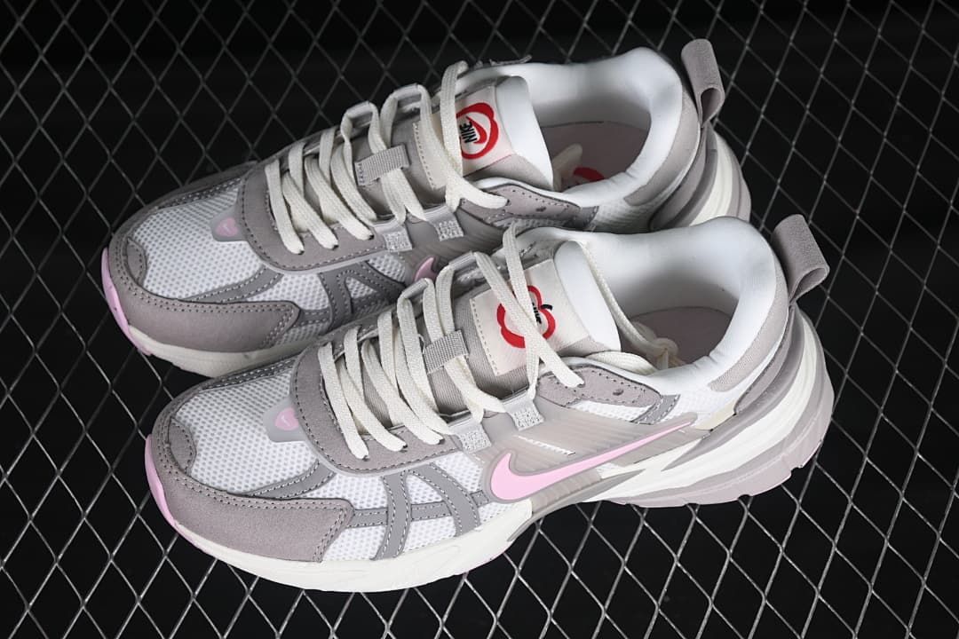 Pair of white, gray, and pink Nike V2K Run Runtekk sneakers