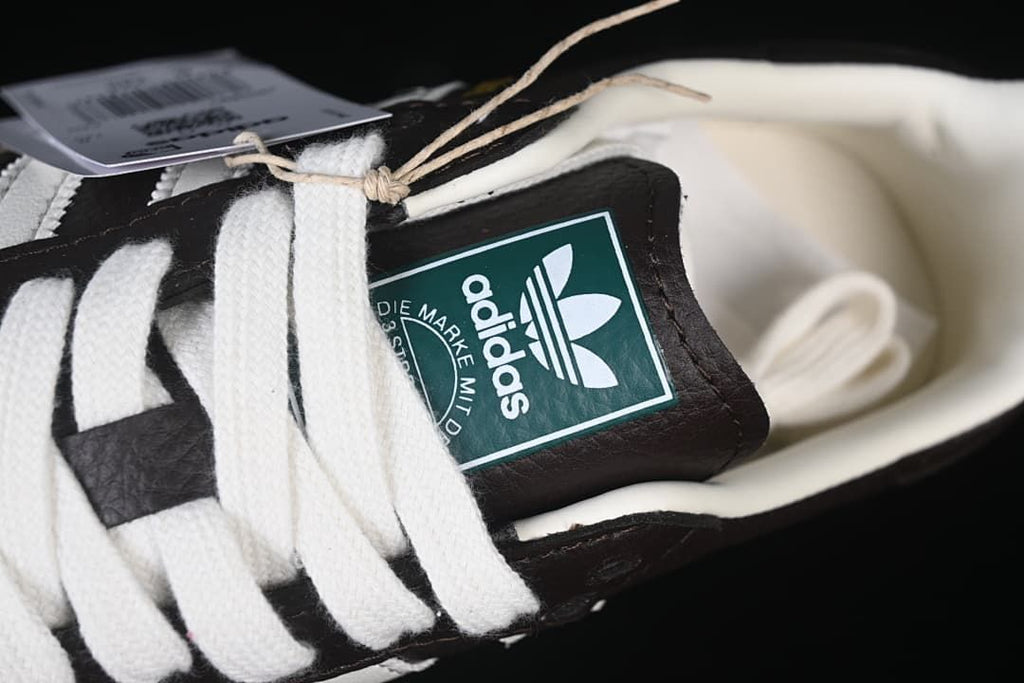 Close-up of the white laces and adidas tongue label