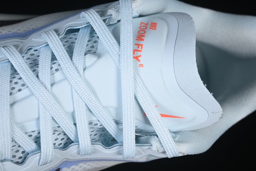 Close-up of laces and tongue marked Nike Zoom Fly 6.