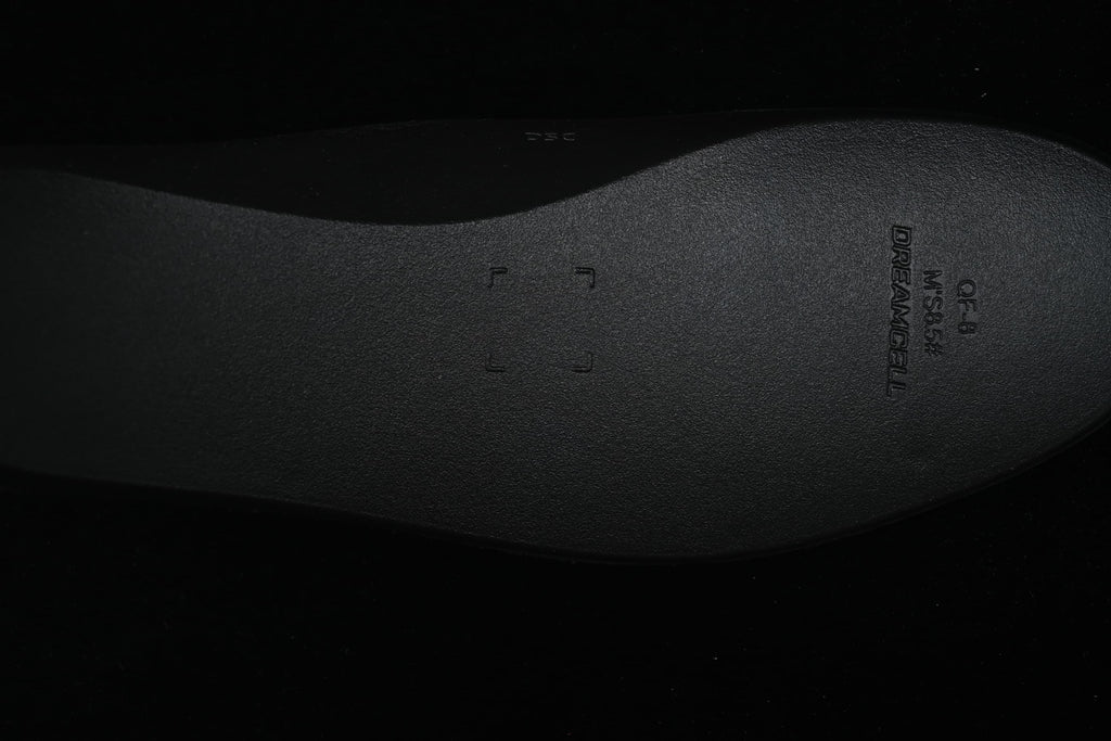 Close-up of the dark insole with molded lettering.