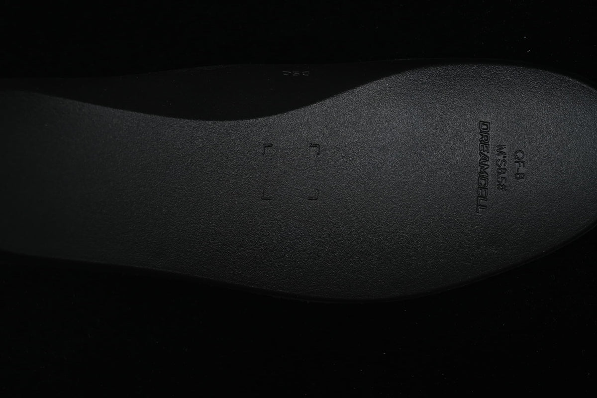 Close-up of the dark insole with molded lettering.
