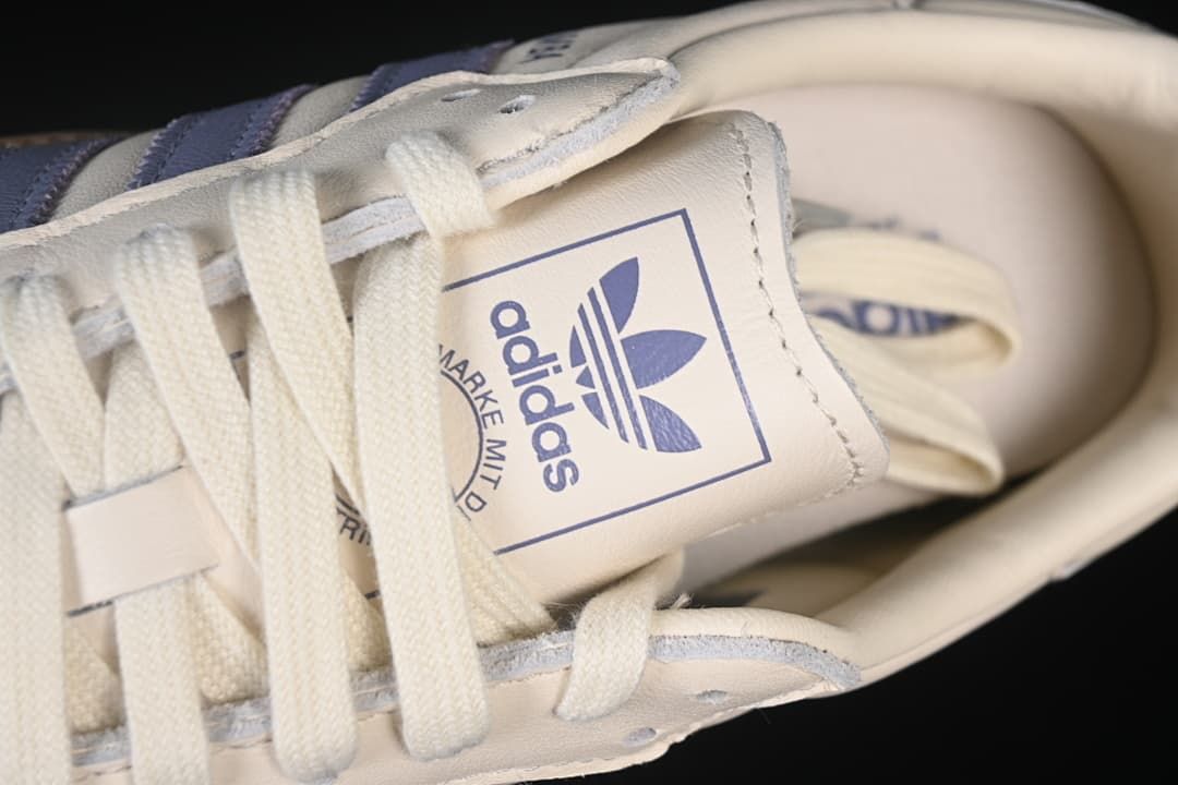Close-up of the tongue branding and cream laces