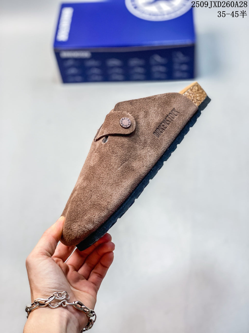 Side profile of the brown closed-toe mule with buckle strap