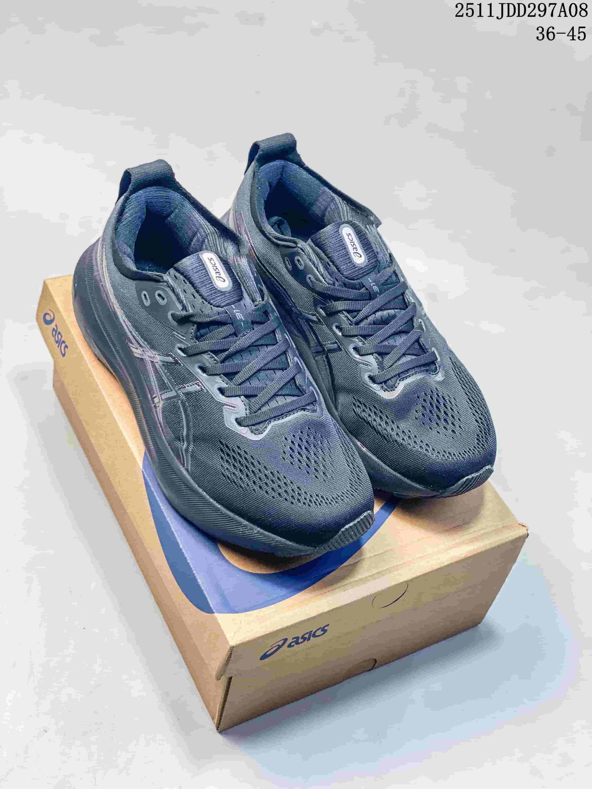 Pair of dark charcoal ASICS GEL-KAYANO sneakers on an ASICS shoe box