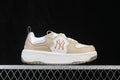 Side view of beige and white MLB Curve Liner sneakers with New York Yankees logo and chunky white sole