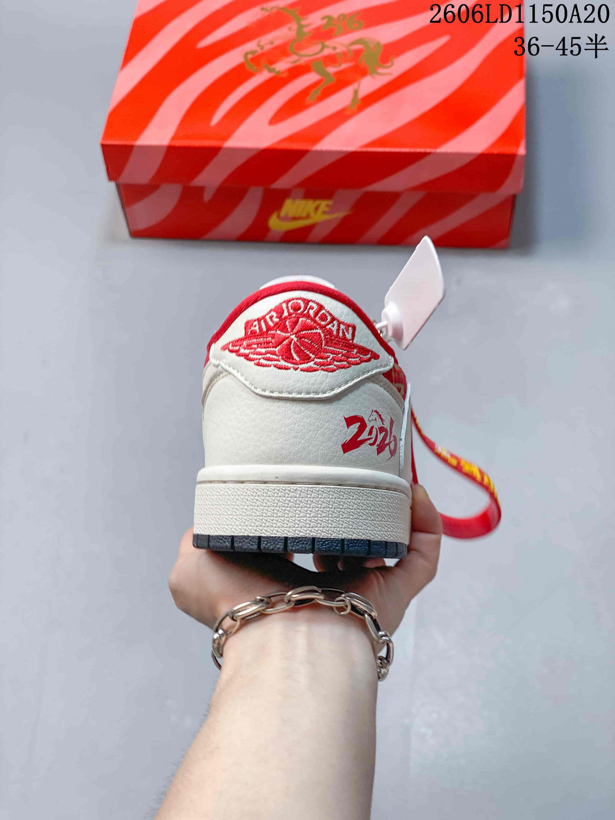 Rear view showing the heel embroidery and red details