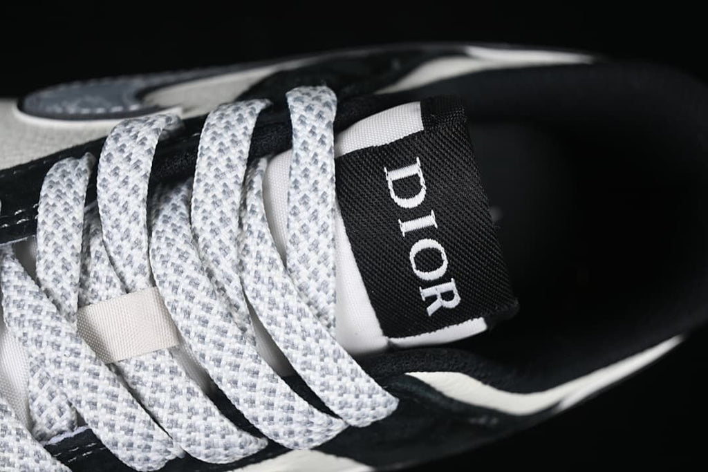 Close-up of patterned laces and a tongue label marked Dior.