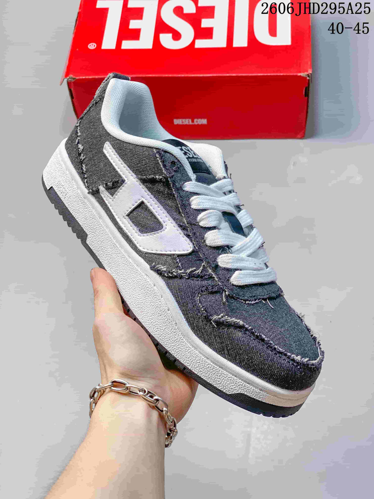 Close-up of a dark charcoal low-top sneaker with white side logo detail