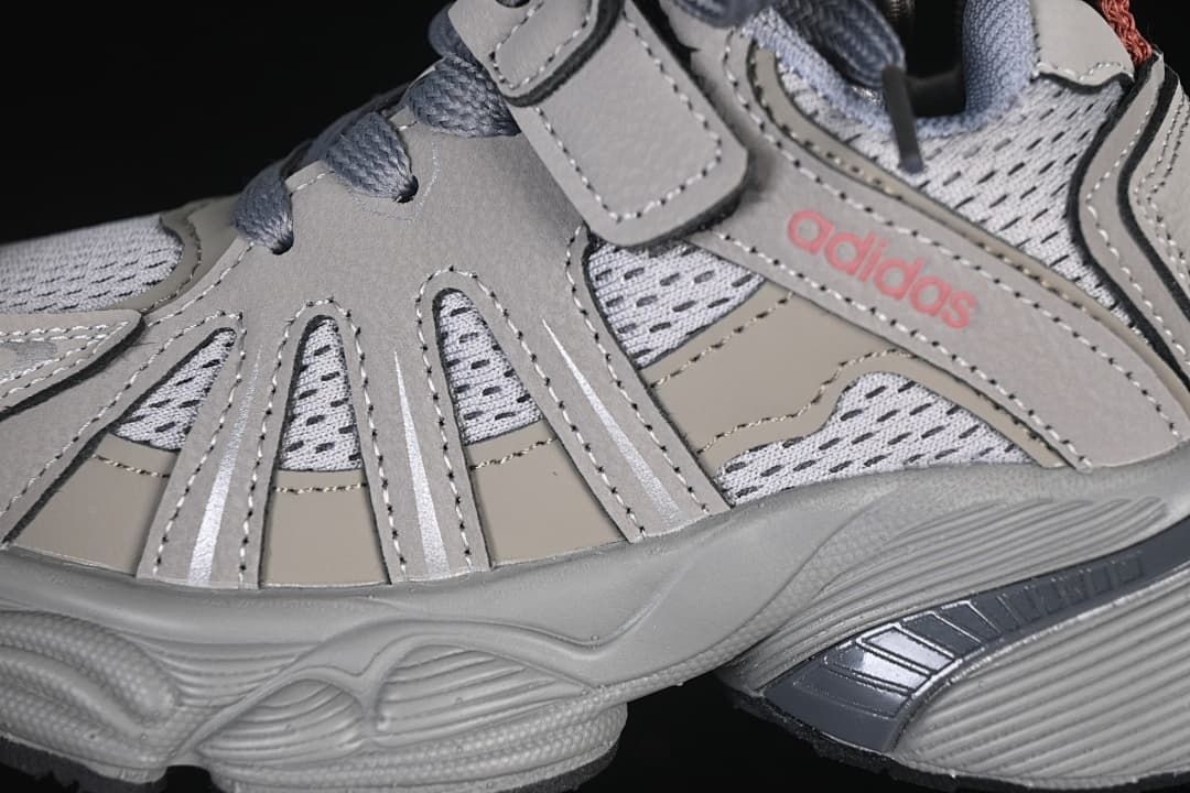 Close-up of the layered side panels, mesh-look upper, and adidas wordmark.