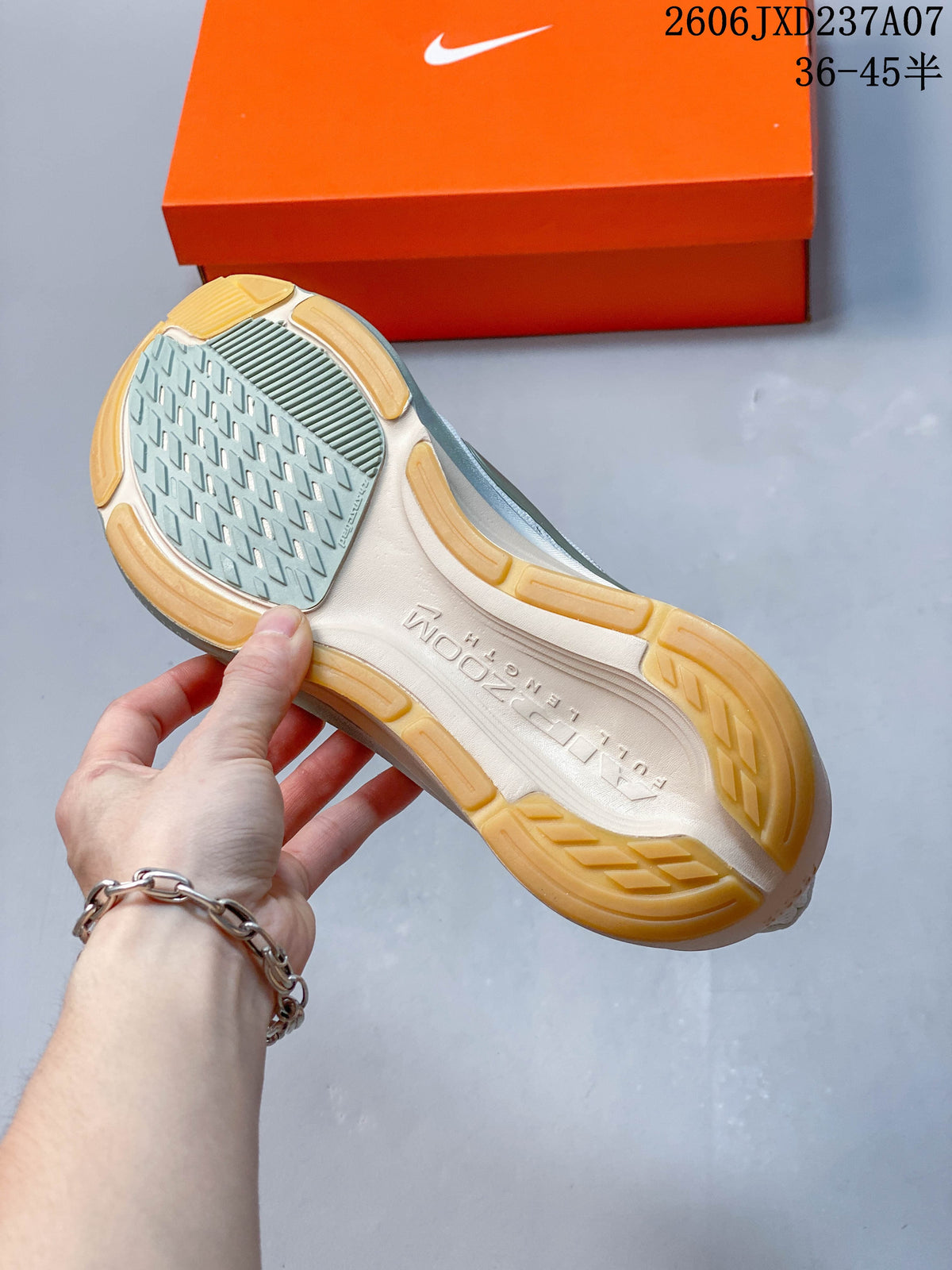 Close-up of the Nike Pegasus 42 outsole with gum-colored sections and patterned tread.