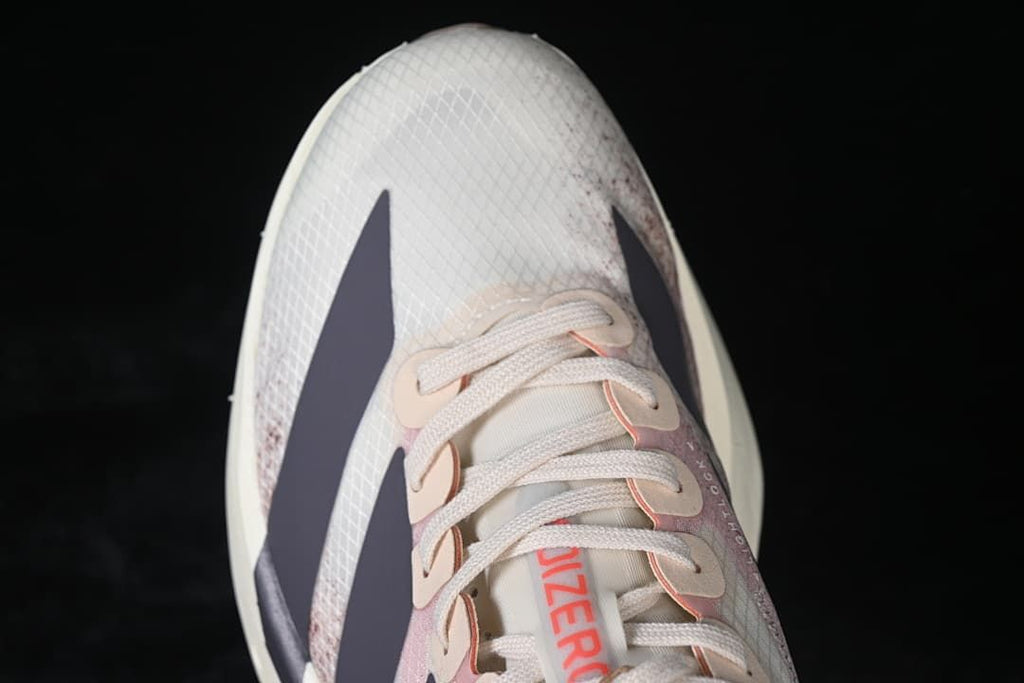 Top-down view of the patterned toe box, laces and dark stripes
