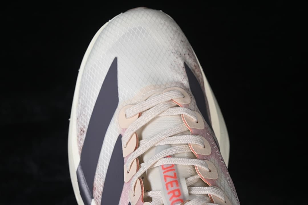 Top-down view of the patterned toe box, laces and dark stripes