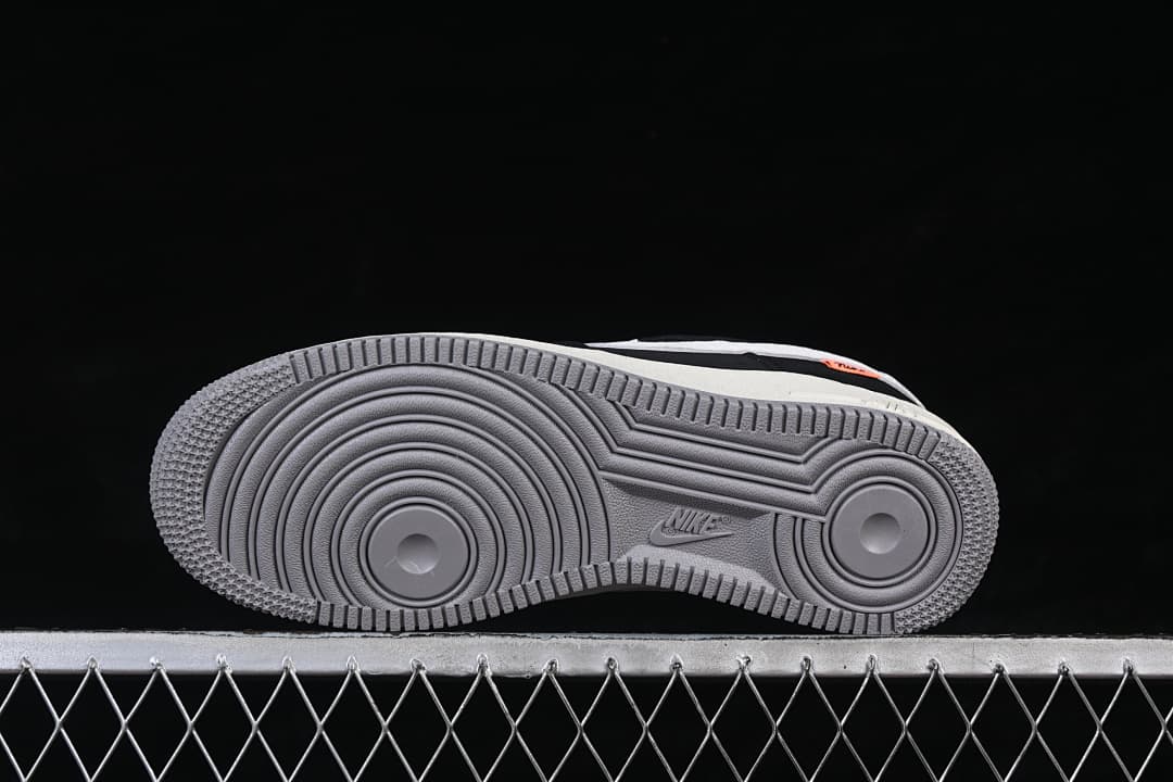 Underside view showing the gray circular-pattern outsole