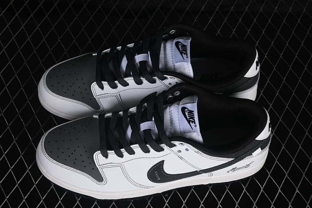 Top view of a pair of white and black Nike SB Dunk Low sneakers