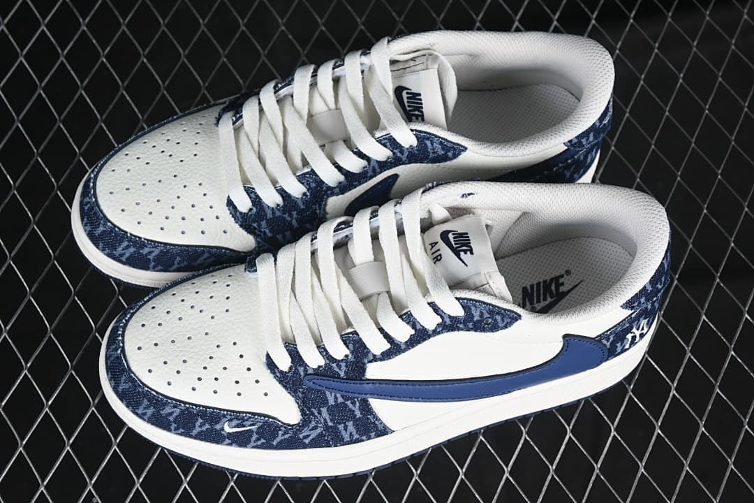 Pair of white and navy low-top sneakers shown from above