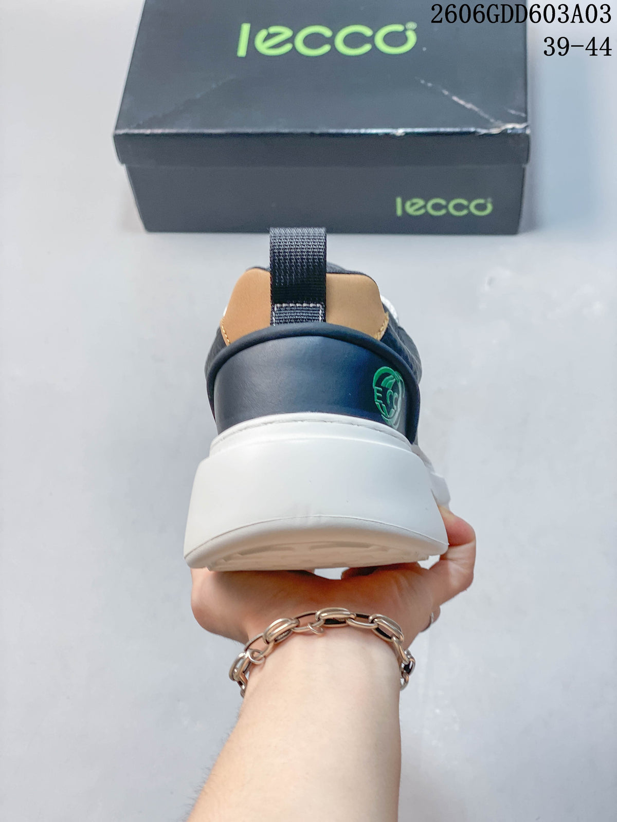 Rear view showing the tan heel accent and thick white sole