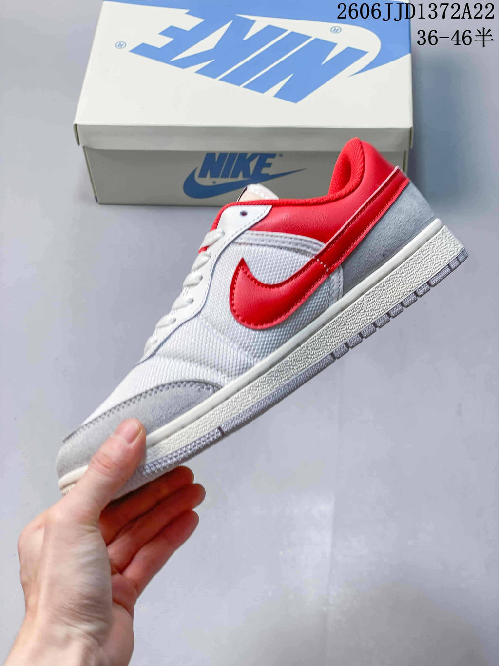 Side profile of the white, red and grey Jordan Skyline low-top sneaker