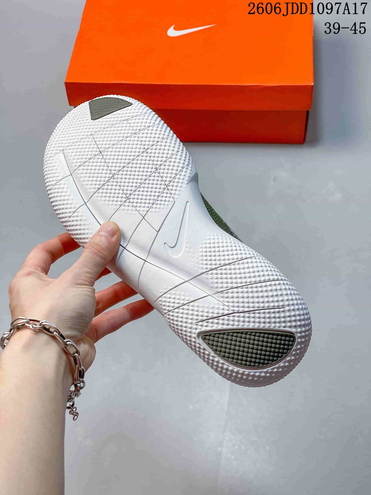 Close-up of the white textured outsole with segmented grooves.