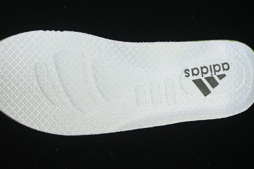 Light-colored insole with adidas branding.