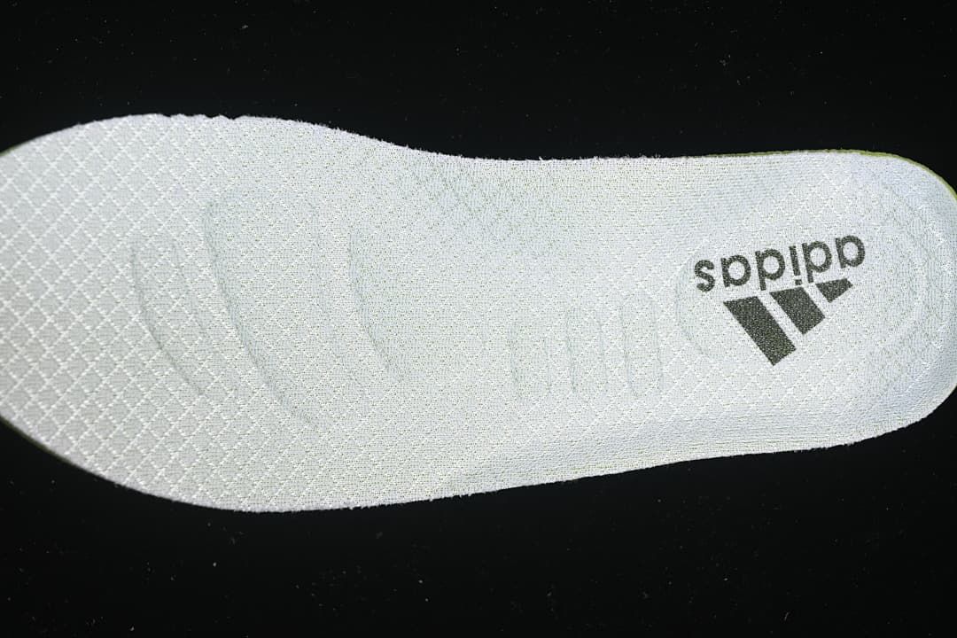 Light-colored insole with adidas branding.
