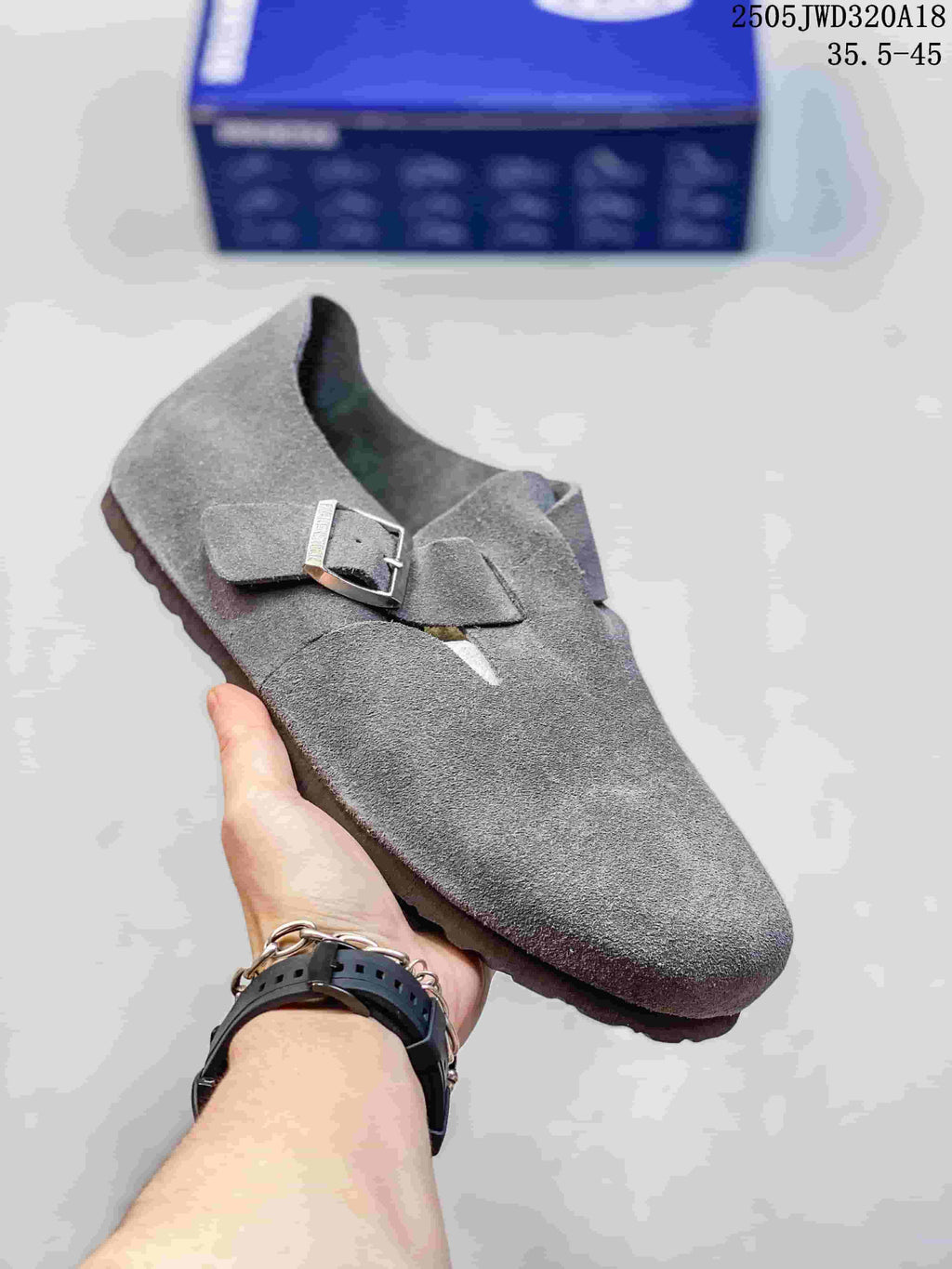 Gray closed-toe clog with two buckle straps; a box is visible in the background.
