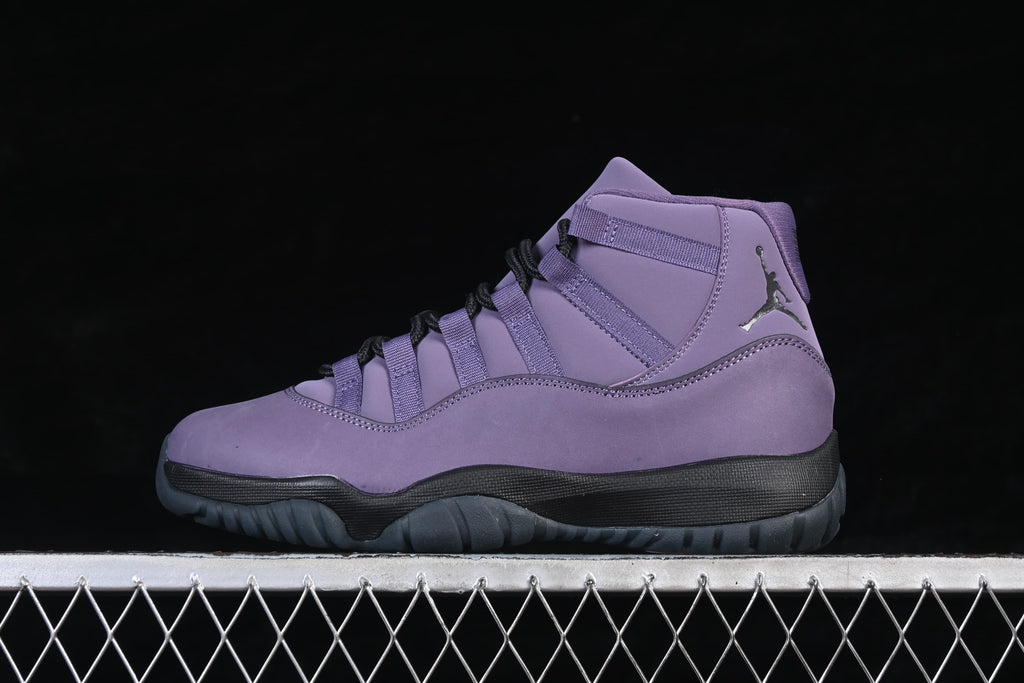 Side view of a purple Air Jordan 11 high-top sneaker with black laces and dark outsole.