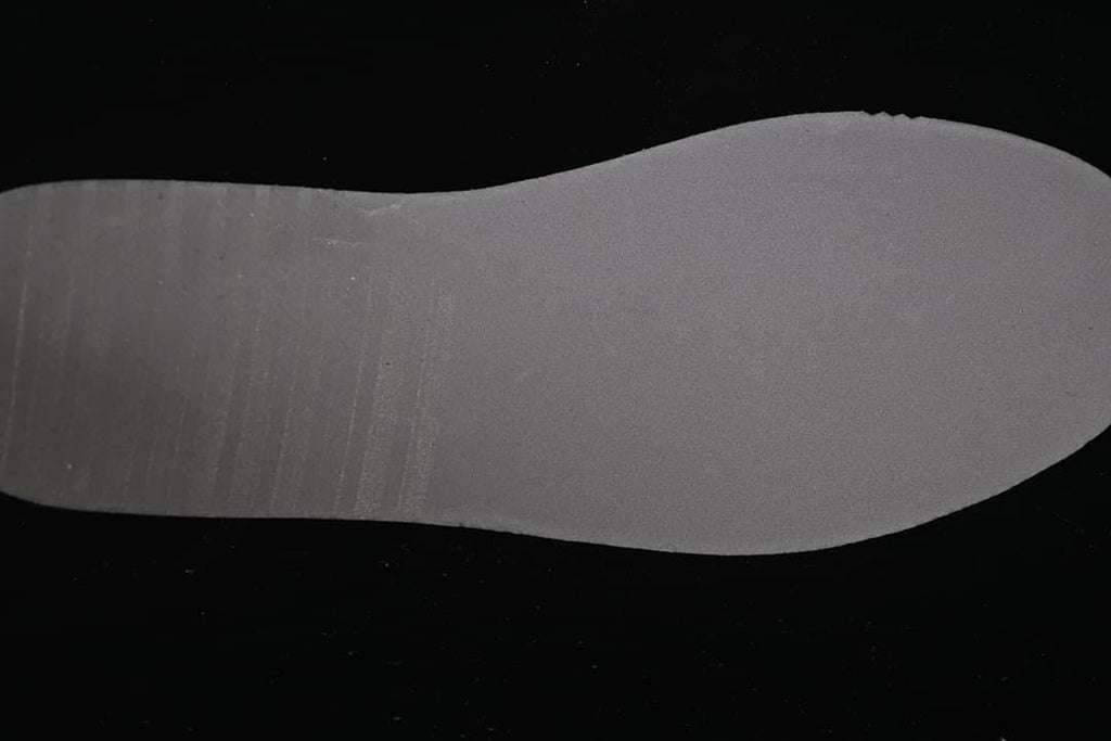Gray-toned outsole shown from below.